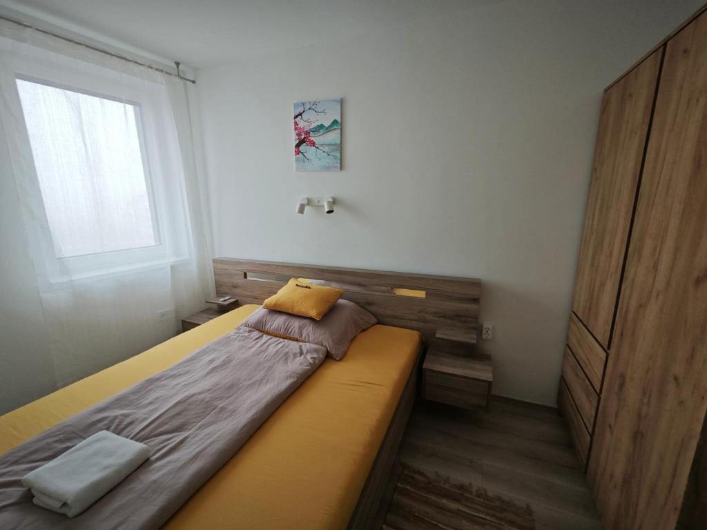 Łóżko lub łóżka w pokoju w obiekcie Hatvan Corner Apartments