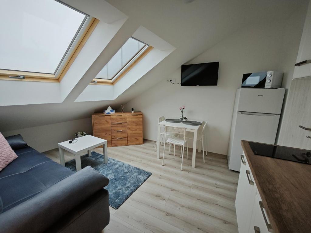 Telewizja i/lub zestaw kina domowego w obiekcie Hatvan Corner Apartments
