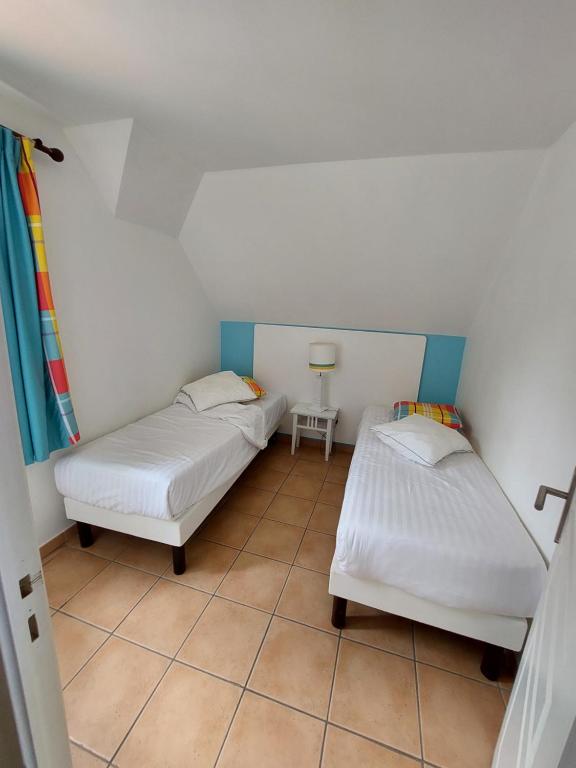 Postel nebo postele na pokoji v ubytování Exceptionnel T3 Vue Mer Village Vacances Sainte Luce