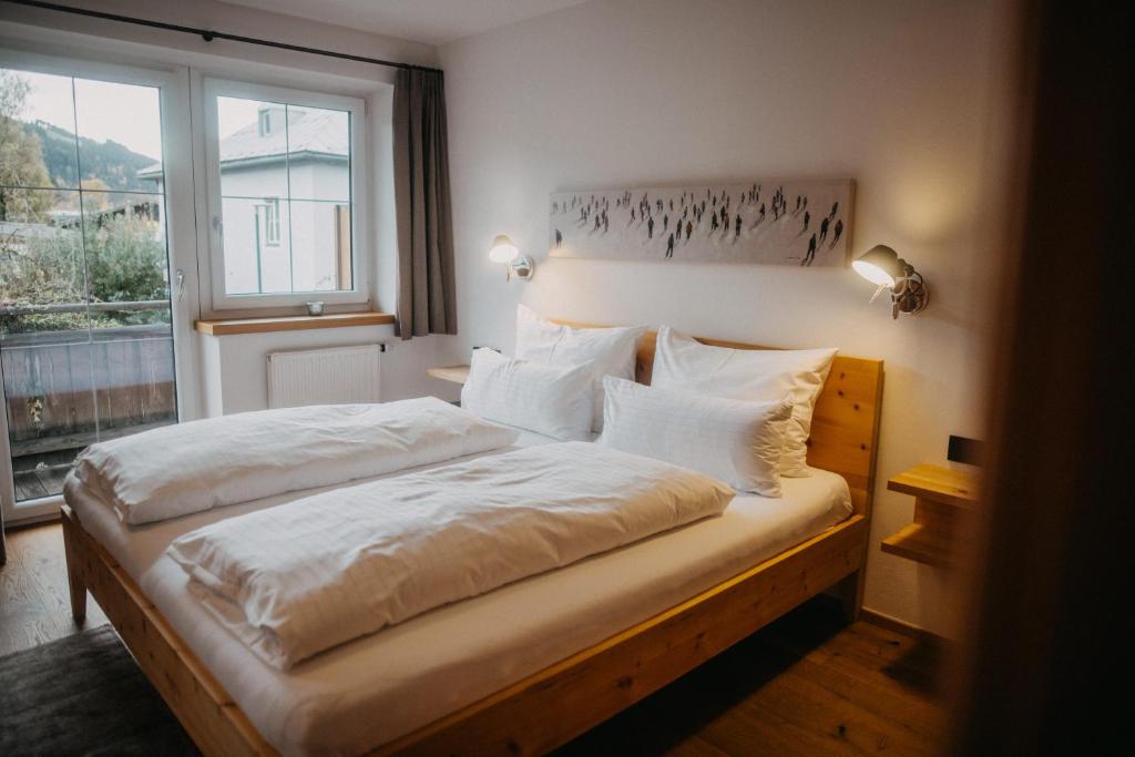 Postel nebo postele na pokoji v ubytování Hotel Alpin Tyrol - Kitzbüheler Alpen