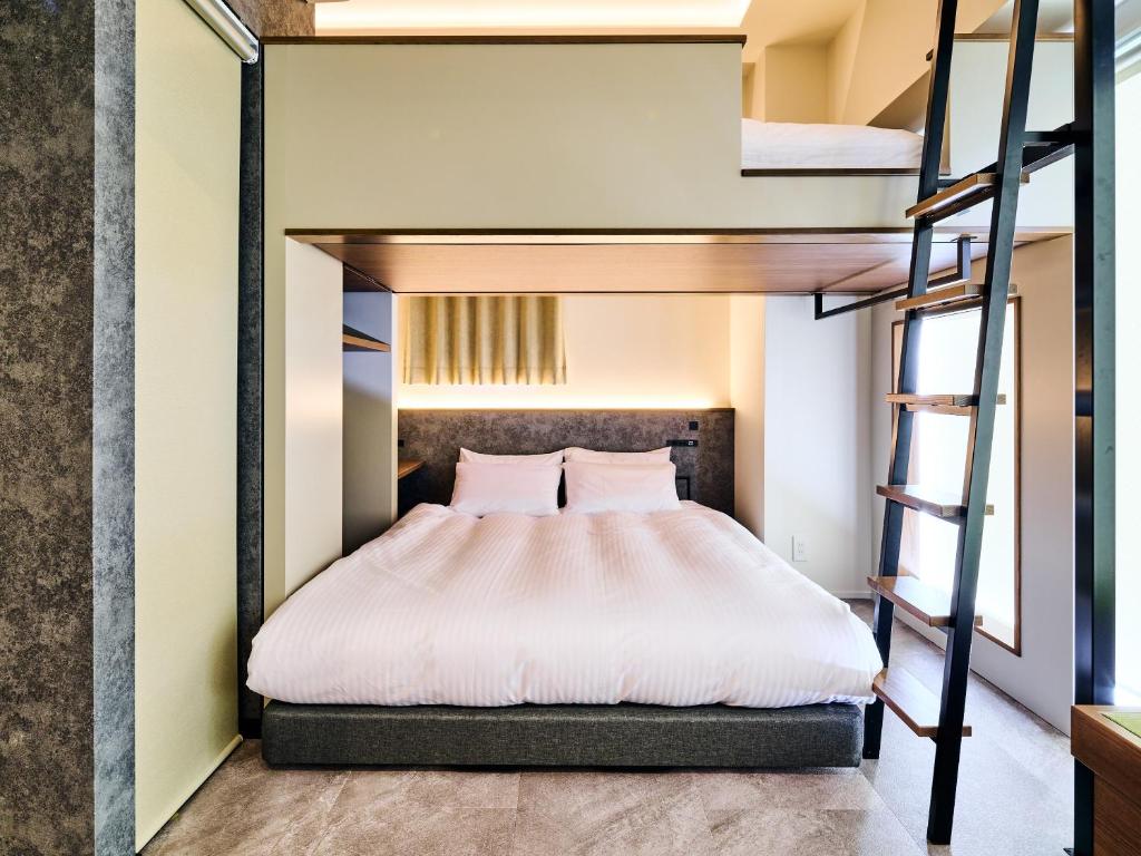 Postel nebo postele na pokoji v ubytování HOTEL ALL IN TOKYO Asakusabashi