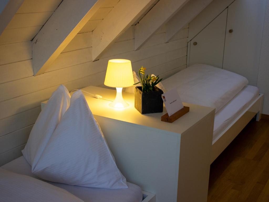 Postel nebo postele na pokoji v ubytování Haus Gutenberg