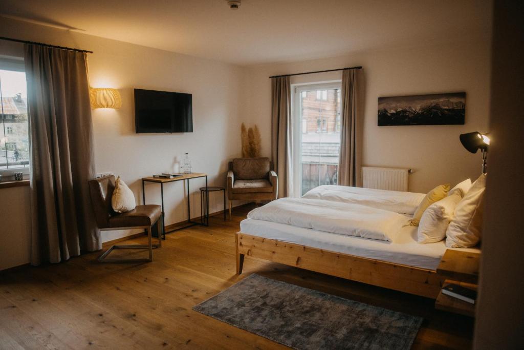 Postel nebo postele na pokoji v ubytování Hotel Alpin Tyrol - Kitzbüheler Alpen