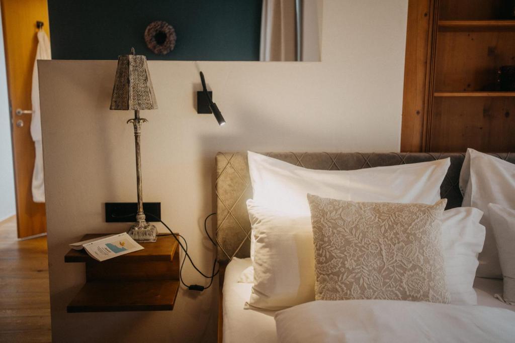 Postel nebo postele na pokoji v ubytování Hotel Alpin Tyrol - Kitzbüheler Alpen