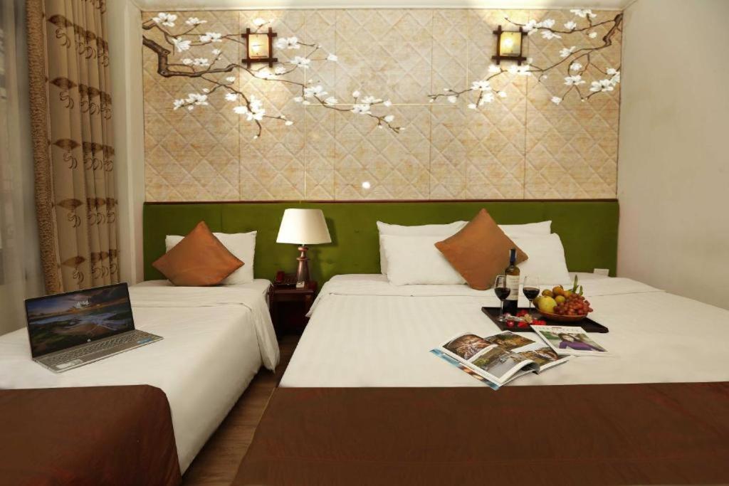 Postel nebo postele na pokoji v ubytování Hanoi Gia Thịnh Hotel & Travel