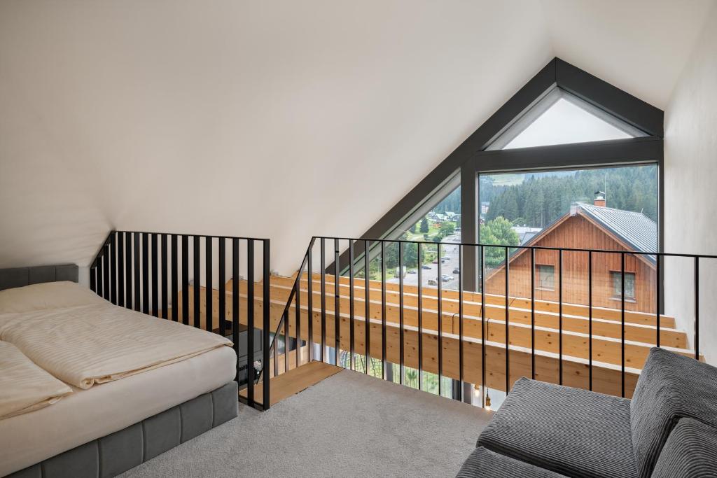 Postel nebo postele na pokoji v ubytování Panorama Lofts Pec