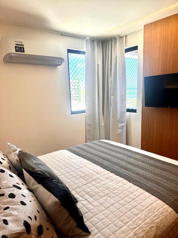 Postel nebo postele na pokoji v ubytování Flat beira-mar, novo!