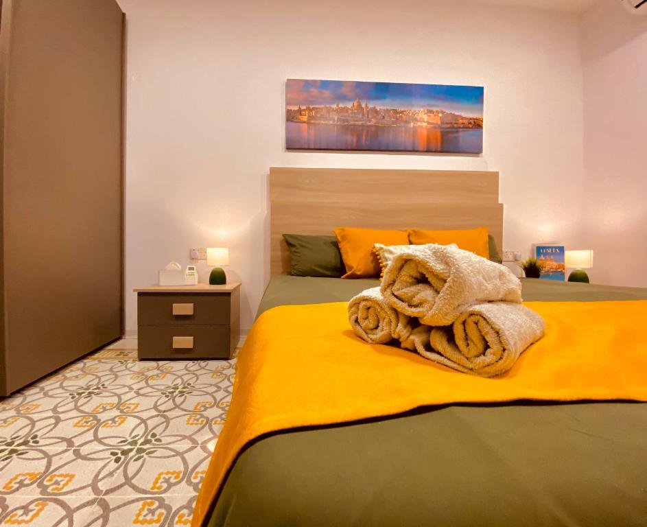 Postel nebo postele na pokoji v ubytování Malta Lodge
