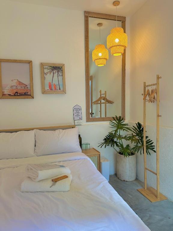 Postel nebo postele na pokoji v ubytování Akap Homestay - Nkd