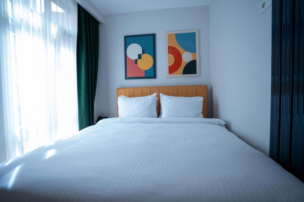 Postel nebo postele na pokoji v ubytování Bird Nest Suites
