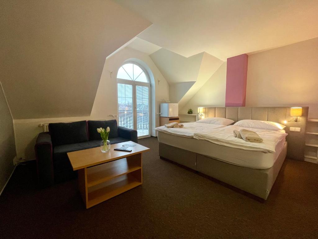 Postel nebo postele na pokoji v ubytování Hotel Aldo