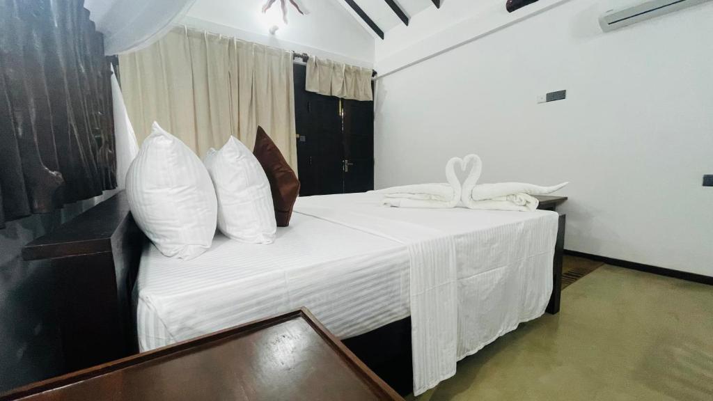 Postel nebo postele na pokoji v ubytování Ela Addara Green Villa