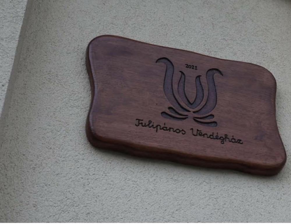 a sign on a wall that reads filipinas university at Tulipános Vendégház in Szőlősardó