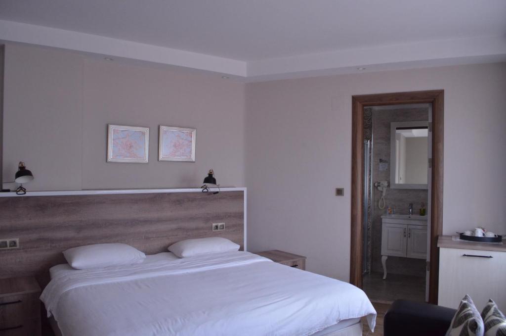 Кровать или кровати в номере Yankı Hotel