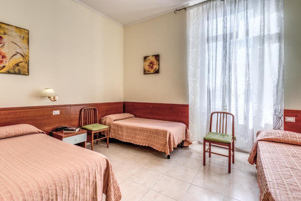 Postel nebo postele na pokoji v ubytování Hotel Katty