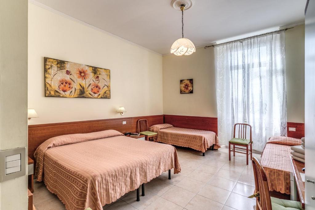Postel nebo postele na pokoji v ubytování Hotel Katty