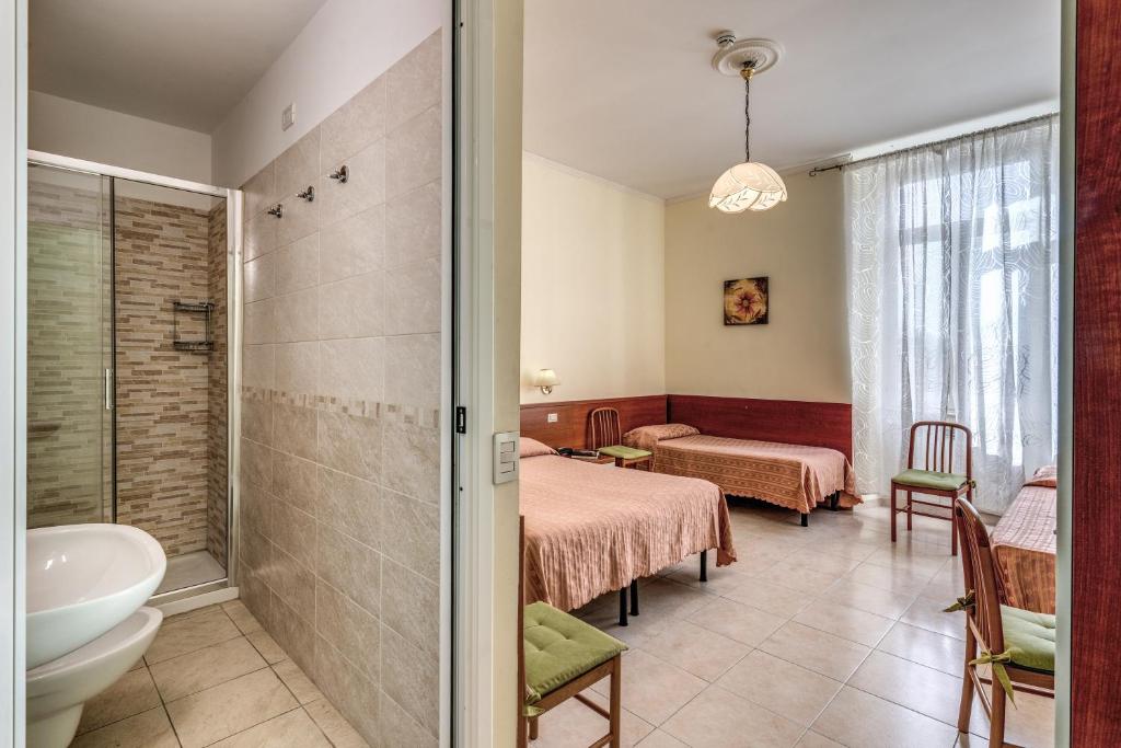 Postel nebo postele na pokoji v ubytování Hotel Katty