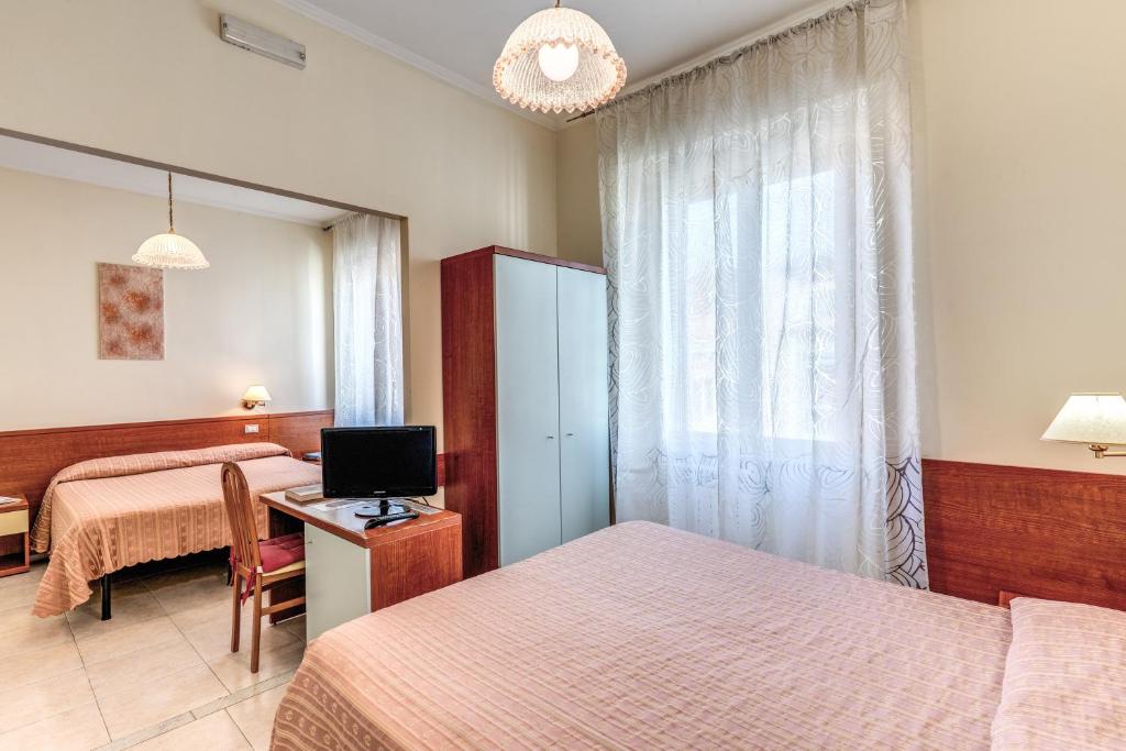Postel nebo postele na pokoji v ubytování Hotel Katty