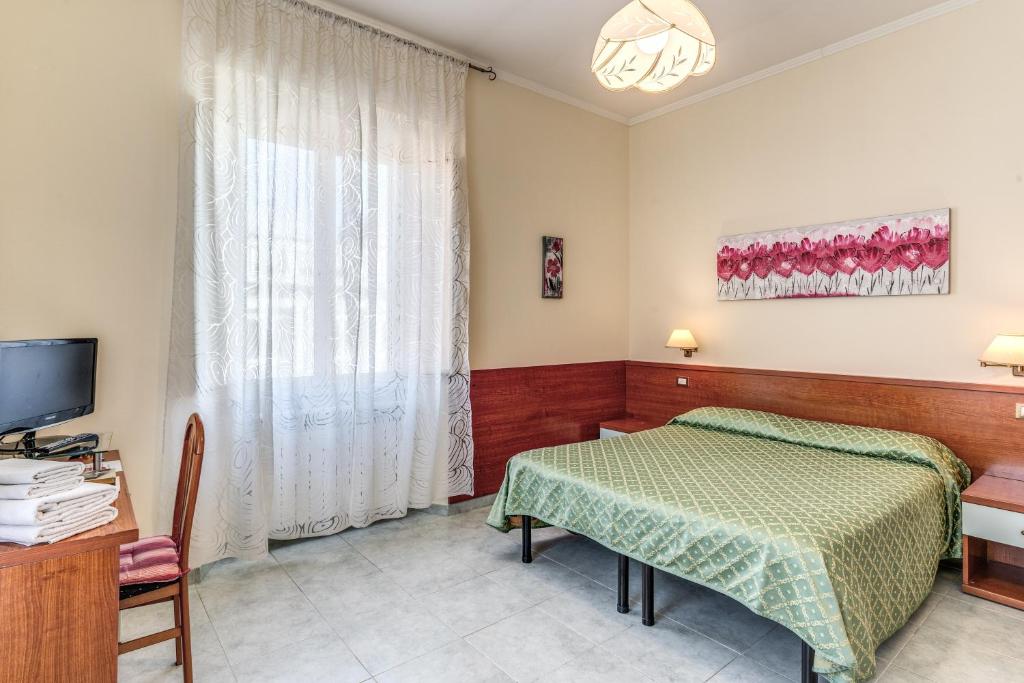 Postel nebo postele na pokoji v ubytování Hotel Katty