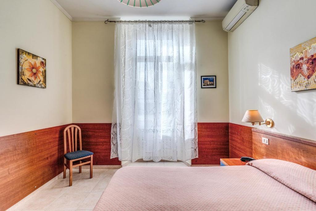 Postel nebo postele na pokoji v ubytování Hotel Katty