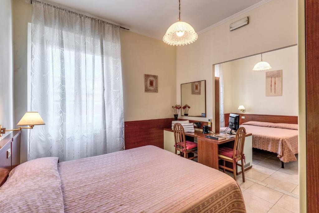 Postel nebo postele na pokoji v ubytování Hotel Katty