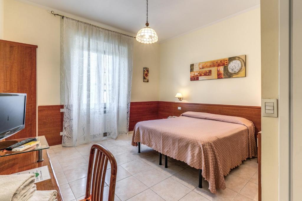 Postel nebo postele na pokoji v ubytování Hotel Katty