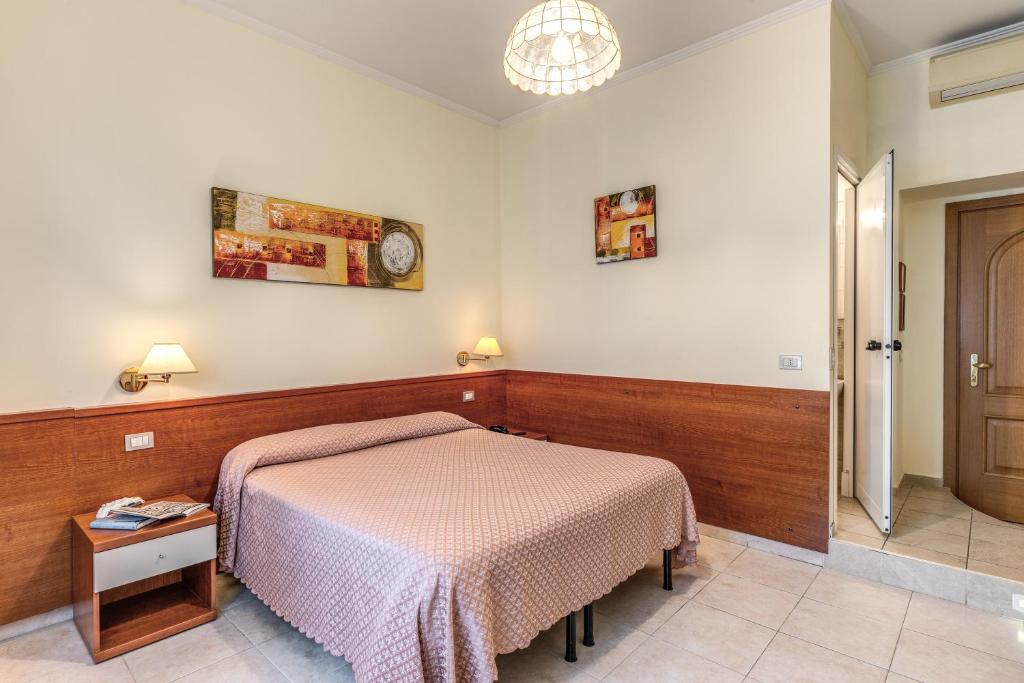 Postel nebo postele na pokoji v ubytování Hotel Katty