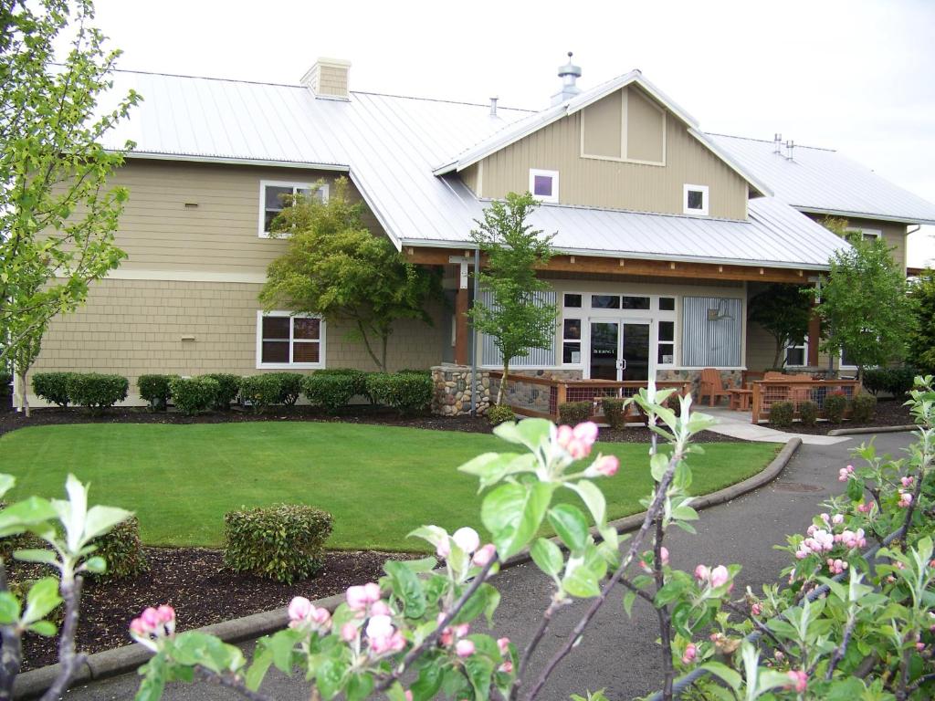 a house with a lawn in front of it at Homestead Resort in Lynden