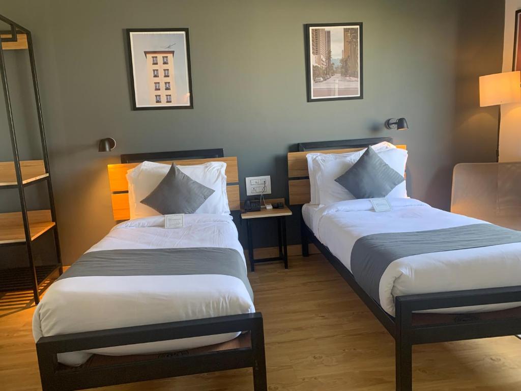 Postel nebo postele na pokoji v ubytování Loft 24, Mansarovar