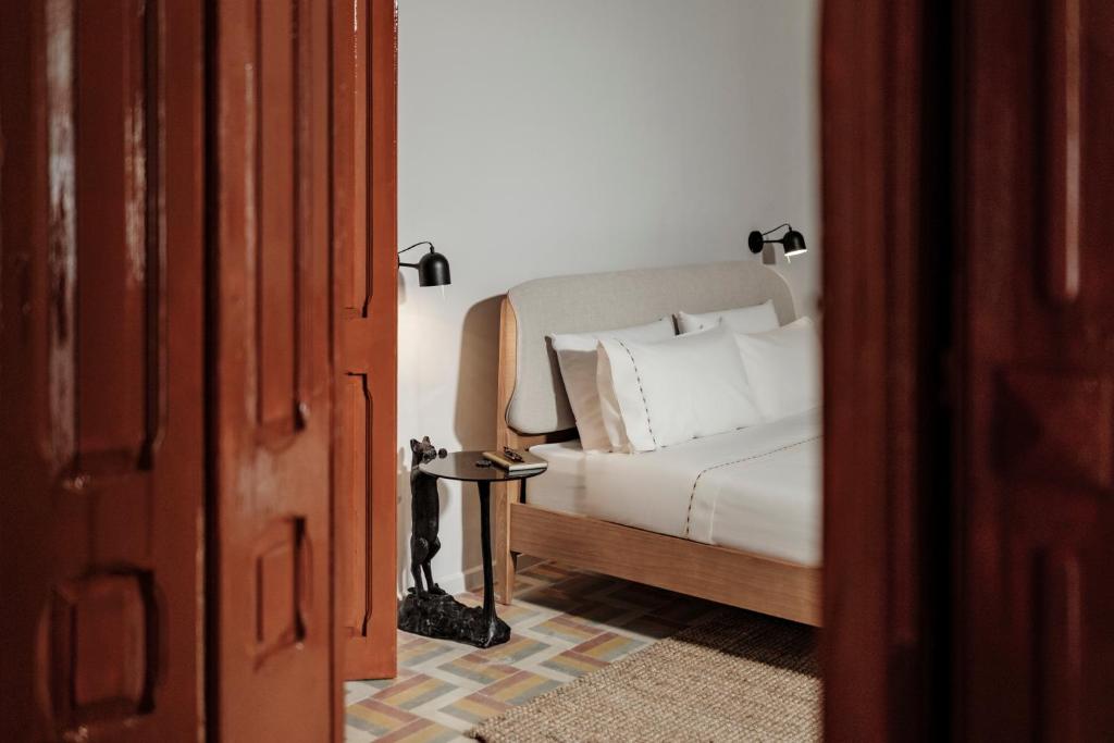 Postel nebo postele na pokoji v ubytování Ellul Living