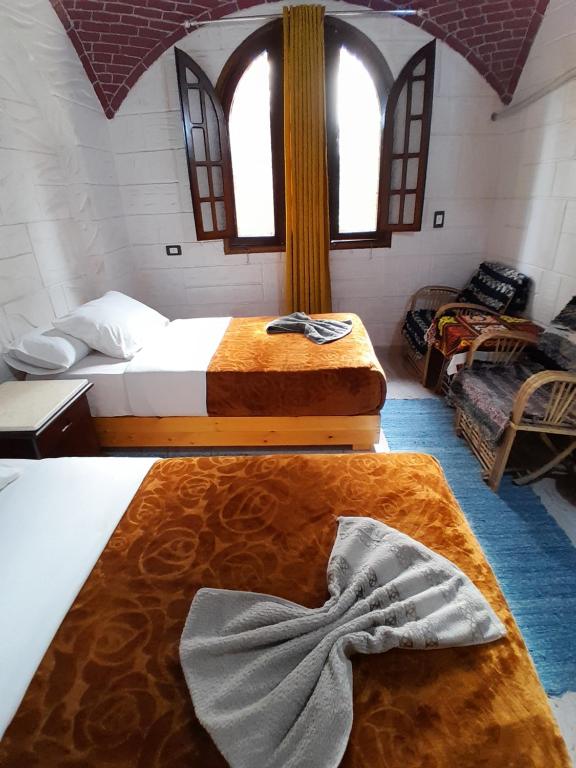 Postel nebo postele na pokoji v ubytování Kashta Nubian Guest Houst