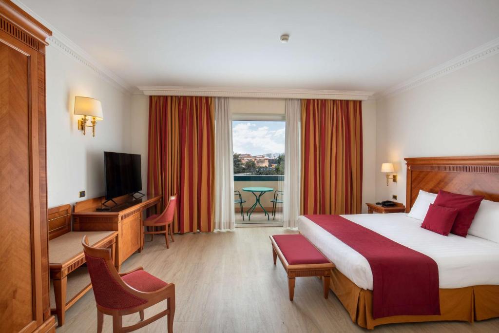 Postel nebo postele na pokoji v ubytování Best Western Hotel Viterbo