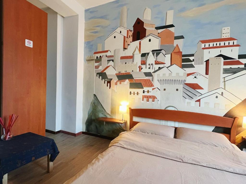 Postel nebo postele na pokoji v ubytování Muse Inn