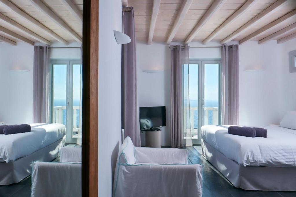 Łóżko lub łóżka w pokoju w obiekcie Ammos Villas