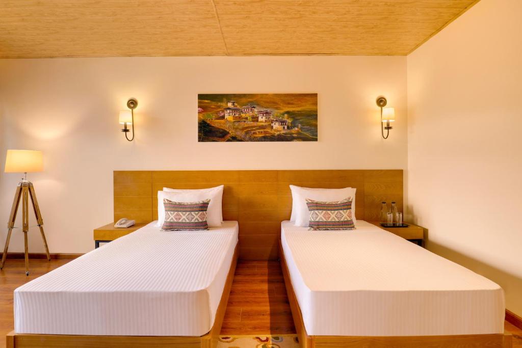Postel nebo postele na pokoji v ubytování Lemon Tree Resort, Thimphu, Bhutan