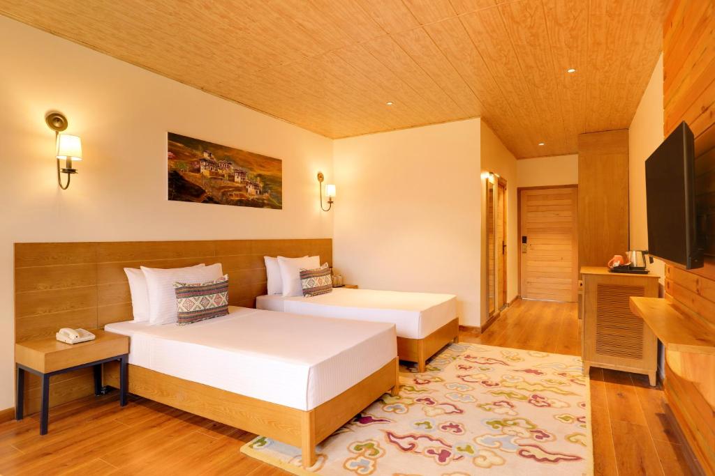 Postel nebo postele na pokoji v ubytování Lemon Tree Resort, Thimphu, Bhutan