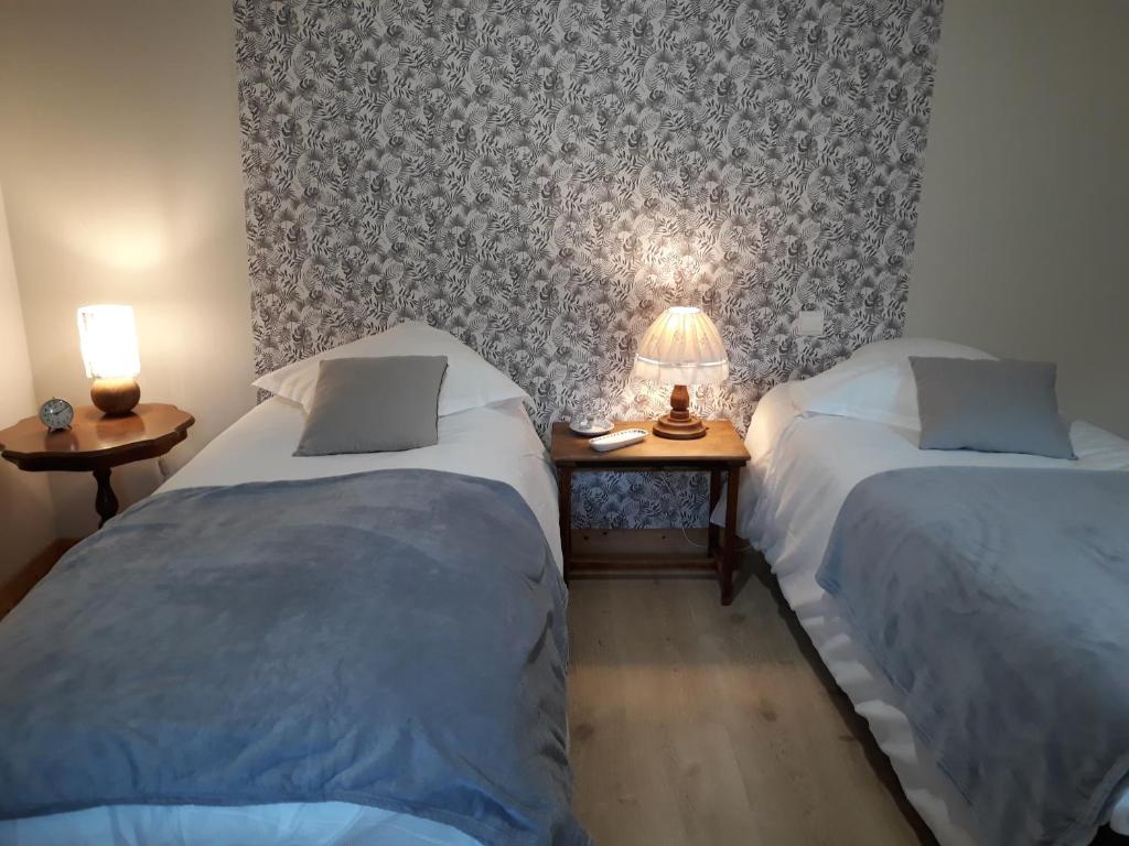 Postel nebo postele na pokoji v ubytování Manoir de Questinguy
