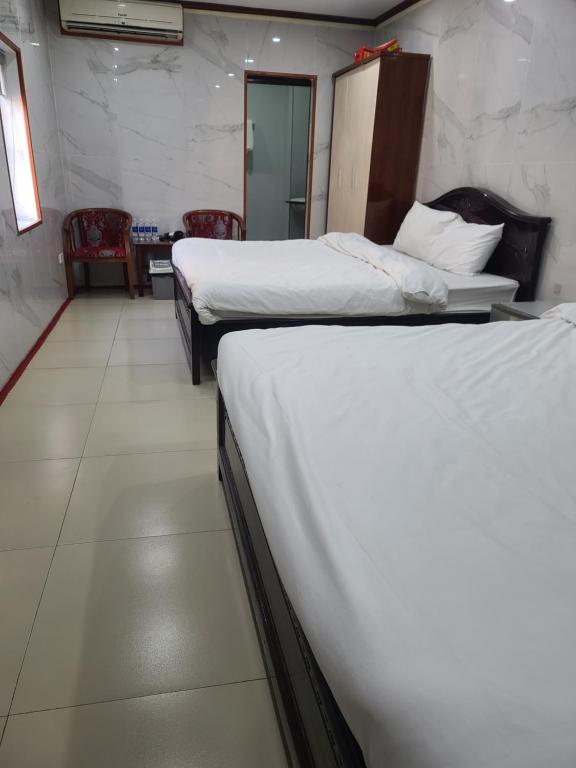 Postel nebo postele na pokoji v ubytování TUAN Central Hotel