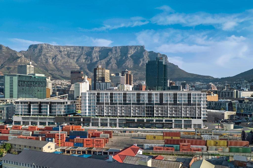a view of a city with mountains in the background at AC Hotel by Marriott Cape Town Waterfront in Cape Town