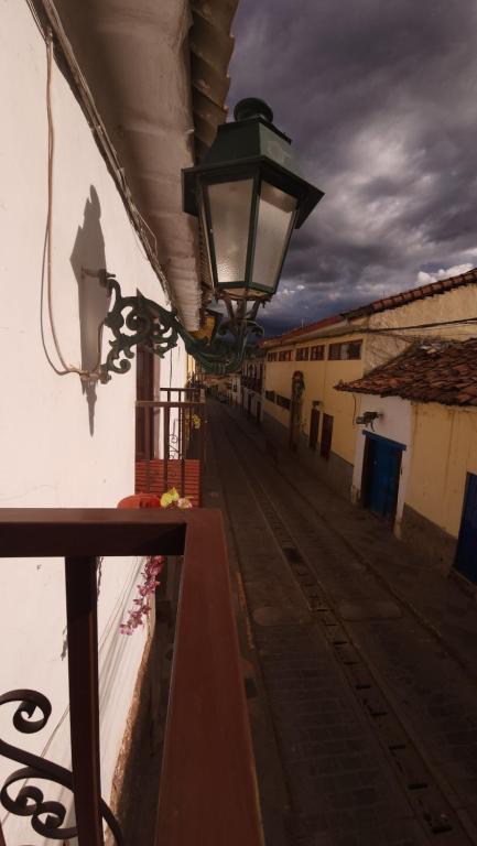 a street light on the side of a building at Antuquita's House in Cusco