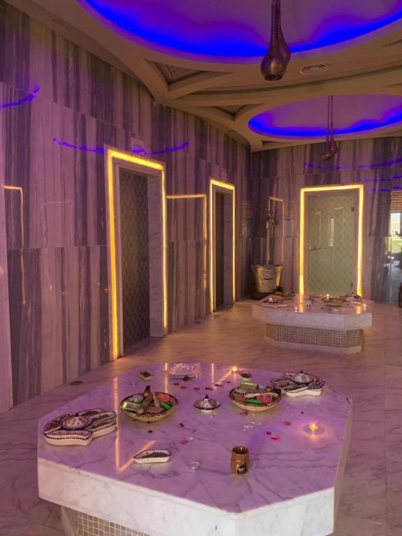 a room with a table with lights on it at Waves Aqua Resort in Kenitra