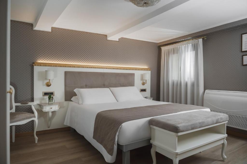 Postel nebo postele na pokoji v ubytování Hotel Montecarlo