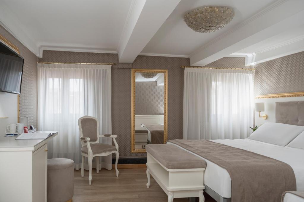 Postel nebo postele na pokoji v ubytování Hotel Montecarlo