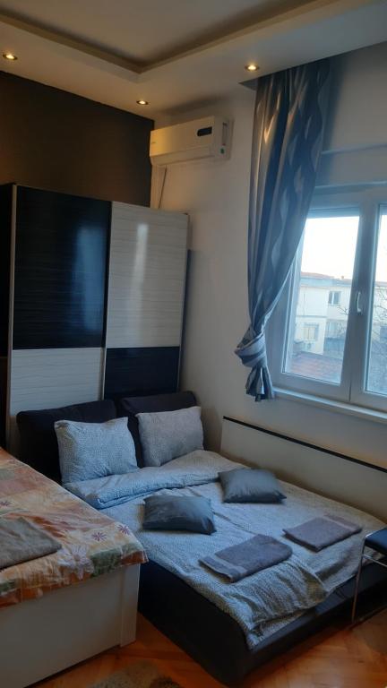 Postel nebo postele na pokoji v ubytování Skadarlija Central