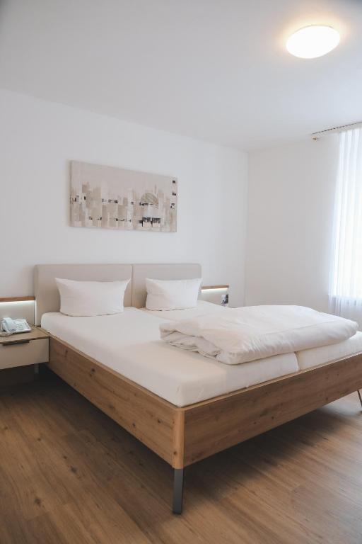 Postel nebo postele na pokoji v ubytování Hotel Restaurant Alt Pirmasens