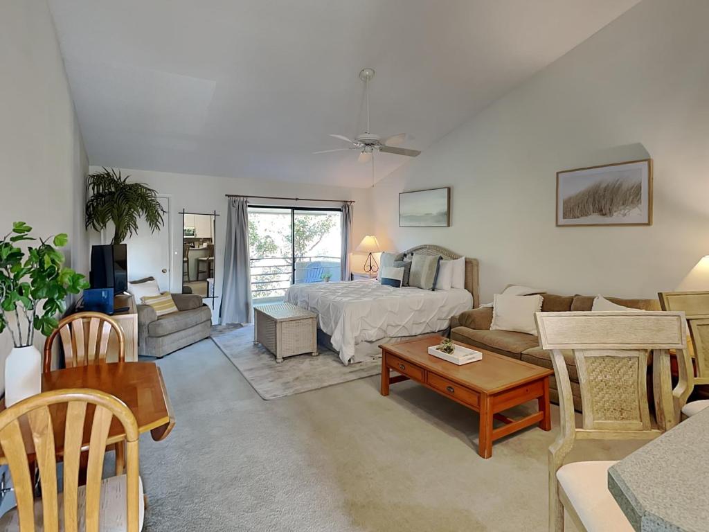 a living room with a bed and a couch at Summer Place 671 in Ponte Vedra