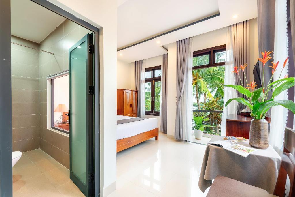 Postel nebo postele na pokoji v ubytování Phuoc Dat Riverside Homestay Hoi An