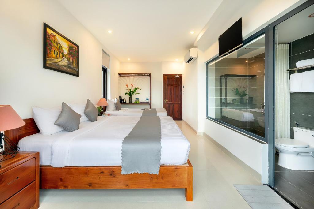 Postel nebo postele na pokoji v ubytování Phuoc Dat Riverside Homestay Hoi An