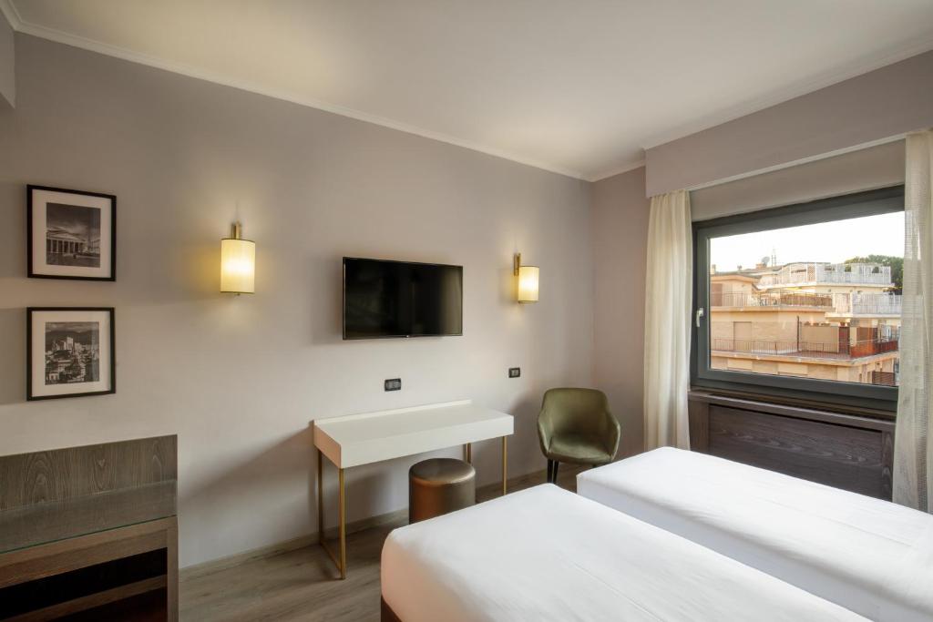 TV a/nebo společenská místnost v ubytování Hotel Marc'Aurelio