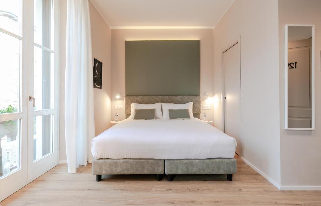 Postel nebo postele na pokoji v ubytování Aiello Hotels - Isola Design District